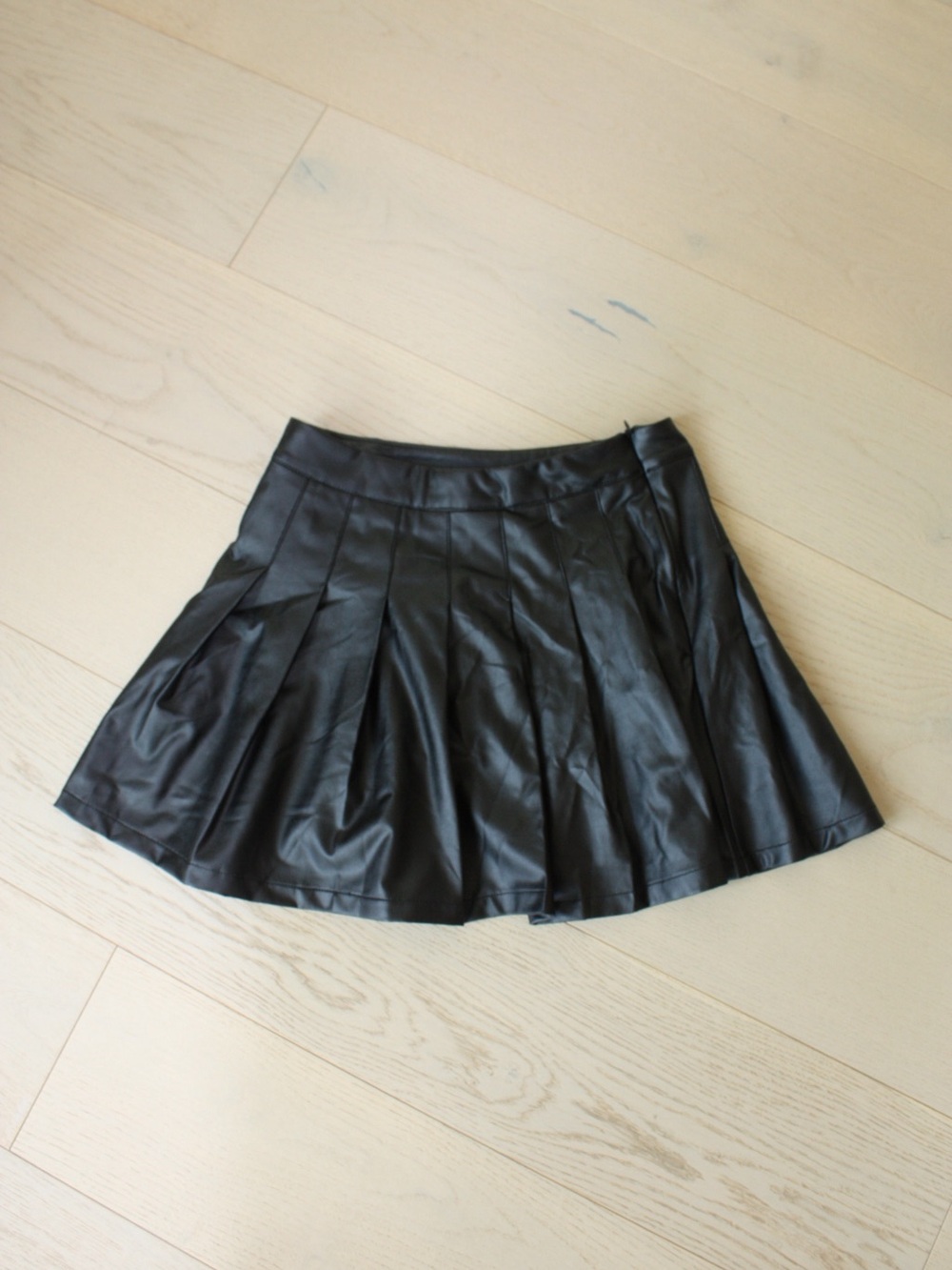 Pleated Faux Leather Mini Skirt in Black